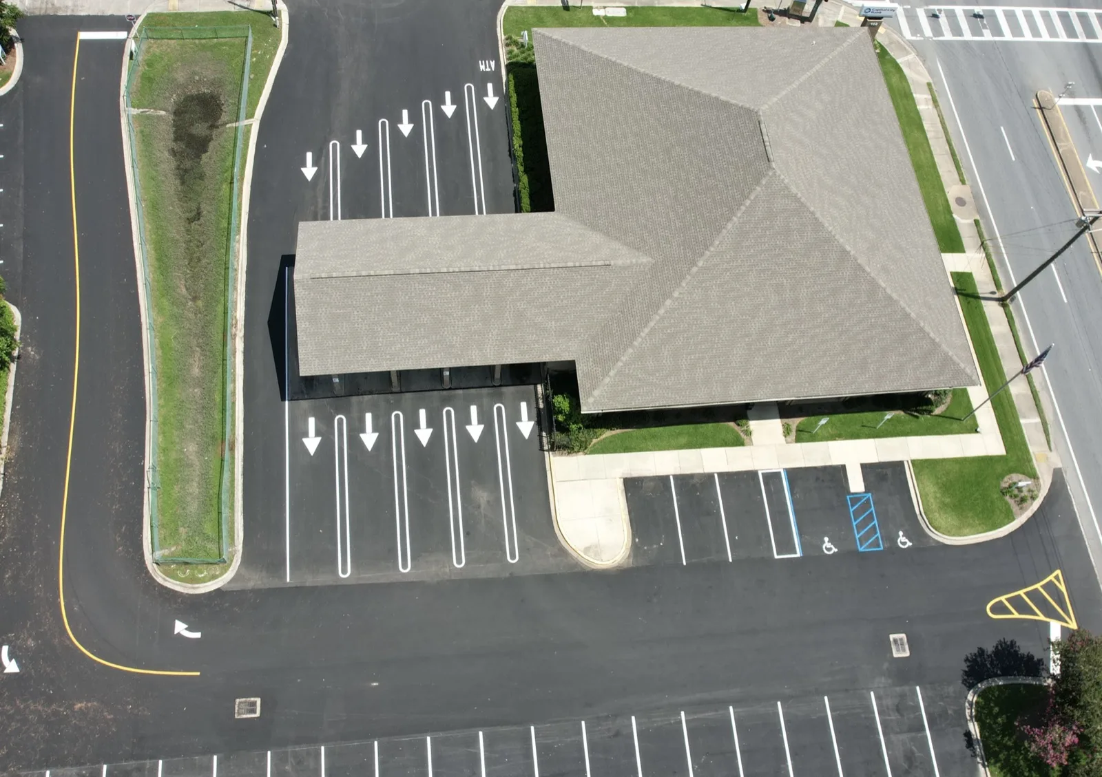 Fresh parking lot striping, arrows and ADA stalls on a commercial lot in Tallahassee